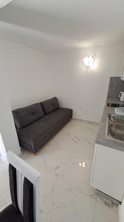 Kuchyň nebo kuchyňský kout v ubytování Apartmani Dodig