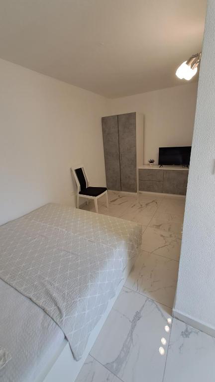 Postel nebo postele na pokoji v ubytování Apartmani Dodig