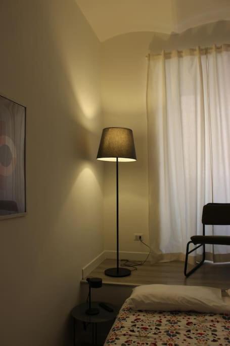 Postel nebo postele na pokoji v ubytování Colosseo Living Suites