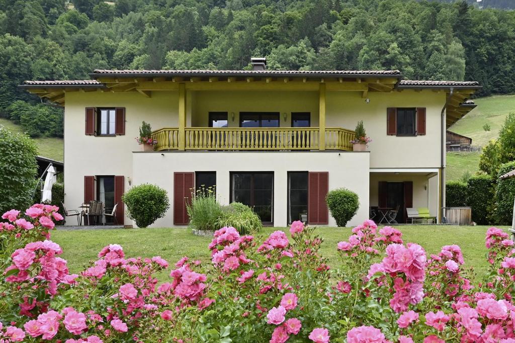 a house with pink flowers in front of it at Ferienhaus Schwarzhans in Schruns