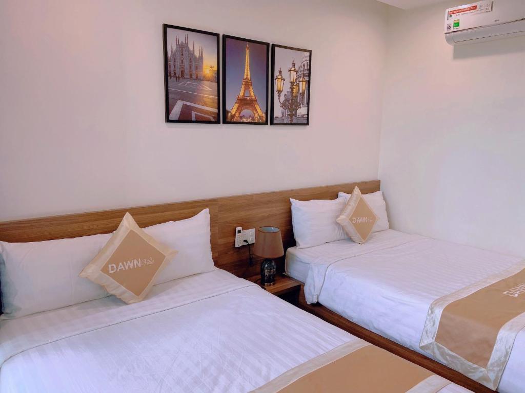 Postel nebo postele na pokoji v ubytování Dawn Villa Homestay Hội An