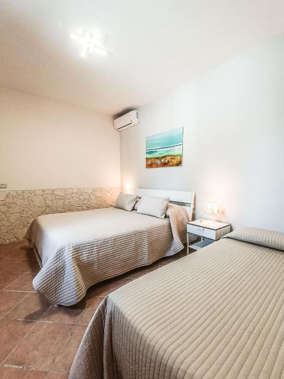Postel nebo postele na pokoji v ubytování Il Giunco B&B