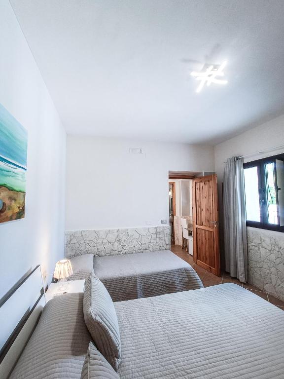 Postel nebo postele na pokoji v ubytování Il Giunco B&B