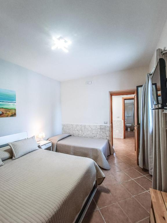 Postel nebo postele na pokoji v ubytování Il Giunco B&B