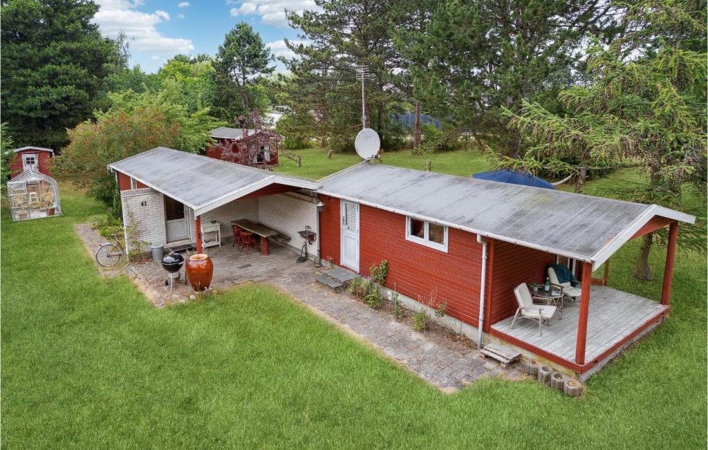 an overhead view of a red house with a roof at Nice Home In Nykøbing Sj With Wifi in Klint