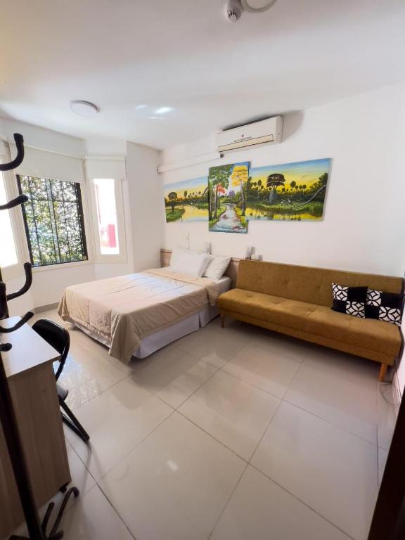 Postel nebo postele na pokoji v ubytování ApartHotel Maison Suisse