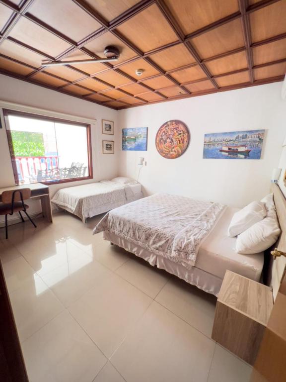Postel nebo postele na pokoji v ubytování ApartHotel Maison Suisse