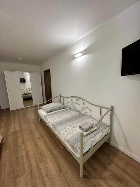 Posteľ alebo postele v izbe v ubytovaní Apartments Villa Ohana
