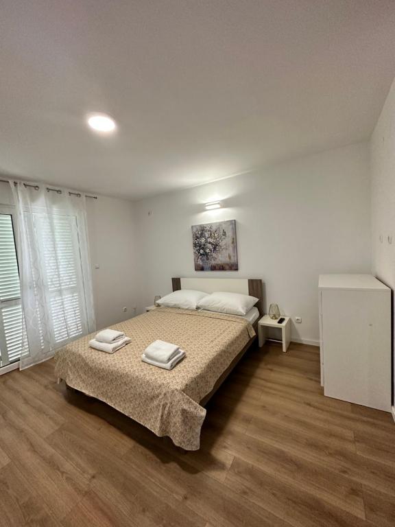 Posteľ alebo postele v izbe v ubytovaní Apartments Villa Ohana