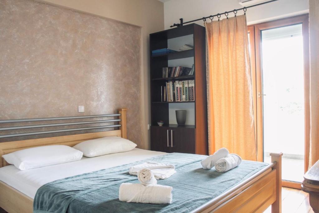 Postel nebo postele na pokoji v ubytování Apartments Art