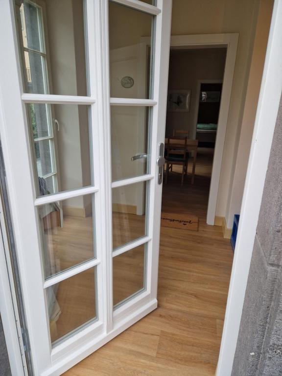 a sliding glass door leading into a living room at Rebhaus Adams in Moselkern