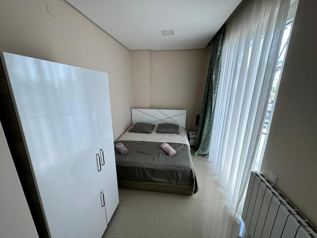 Postel nebo postele na pokoji v ubytování National+