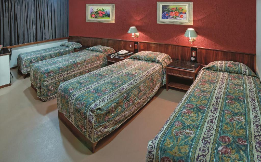 Postel nebo postele na pokoji v ubytování Lira Hotel