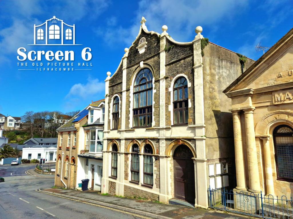 an old building on the side of a street at 4 bedroom 'Screen6' by Tunnels Beaches in a historic building in Ilfracombe