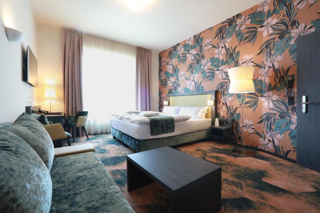 Postel nebo postele na pokoji v ubytování SPREE. Hotel am Hafen