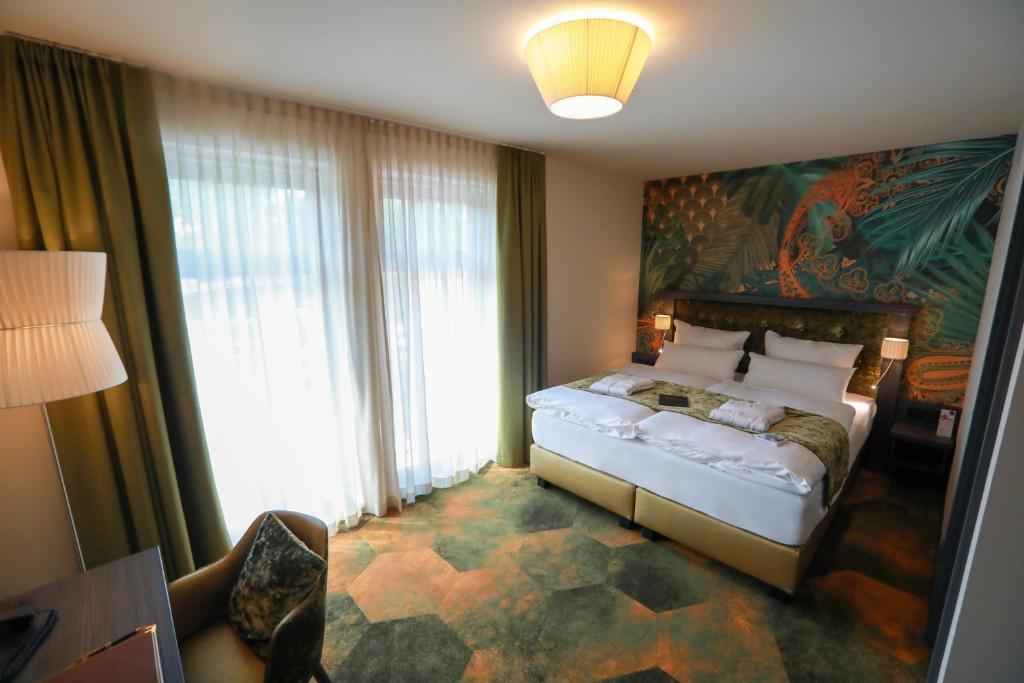 Postel nebo postele na pokoji v ubytování SPREE. Hotel am Hafen