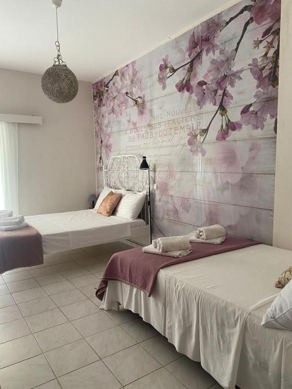 Postel nebo postele na pokoji v ubytování Seaside pearl