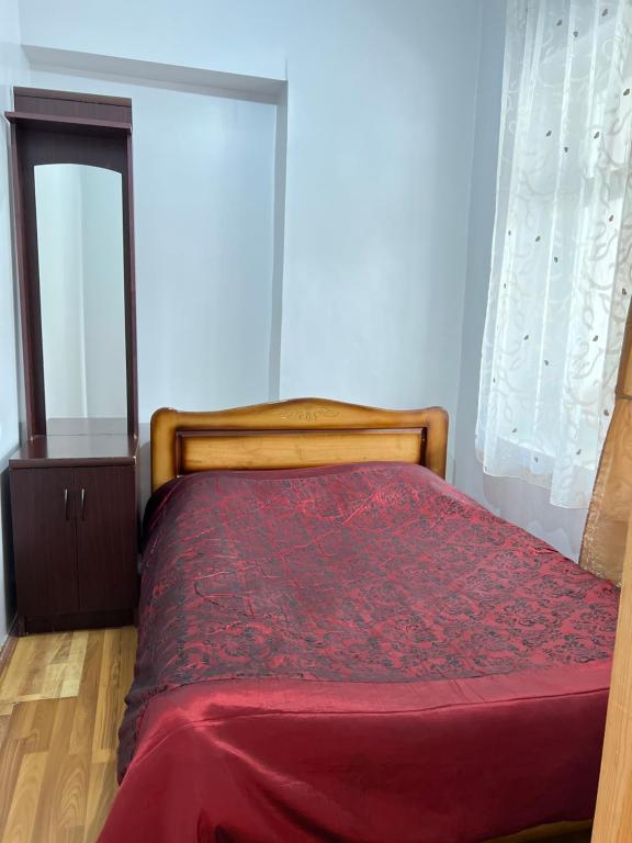 Postel nebo postele na pokoji v ubytování Manoni Ratiani's Hostel