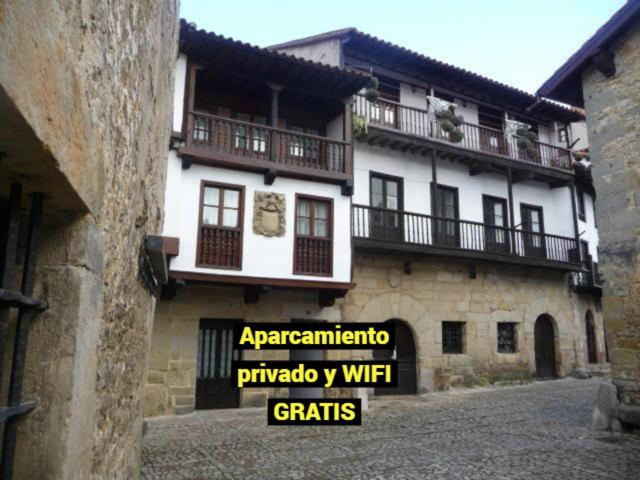 a building with a sign in front of it at Legado de Santillana in Santillana del Mar