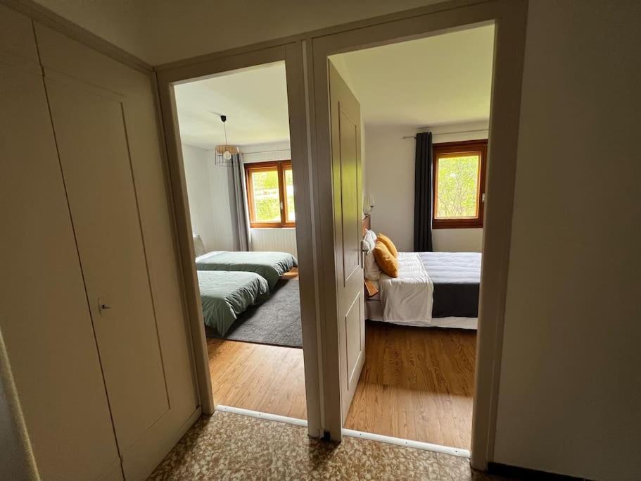 En eller flere senger p&aring; et rom p&aring; Appartement dans chalet - 75 m2 - 4 &agrave; 6 personnes