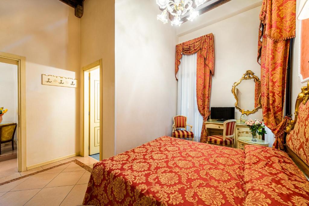 Postel nebo postele na pokoji v ubytování Hotel Al Vagon