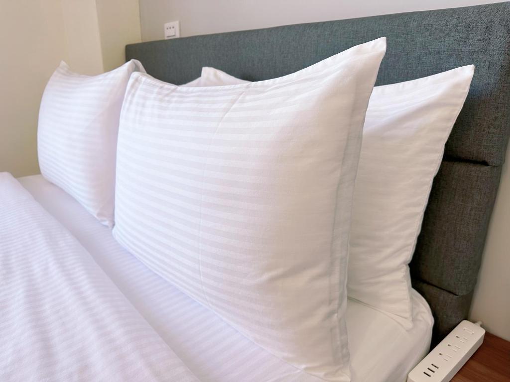 Letto o letti in una camera di Happy Fat B&B 寵物友善