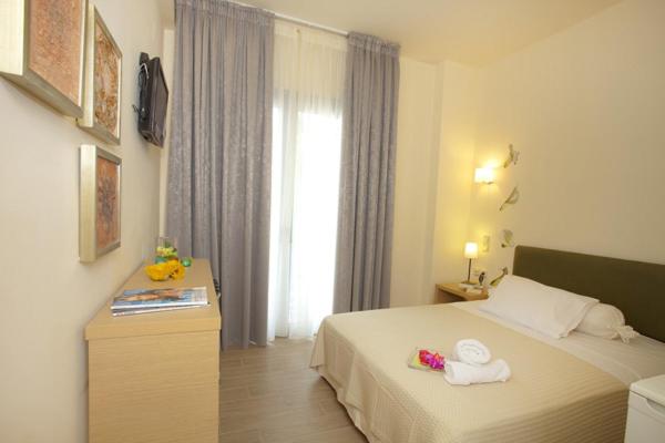 Postel nebo postele na pokoji v ubytování Ilion Spa Hotel