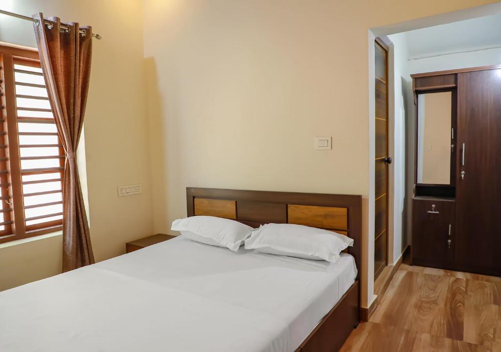 Postel nebo postele na pokoji v ubytování CELESTIAL HOMESTAY