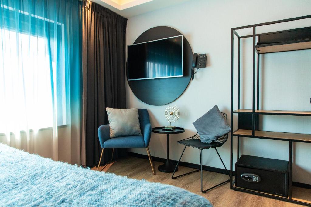 Postel nebo postele na pokoji v ubytování Palace Hotel Zandvoort