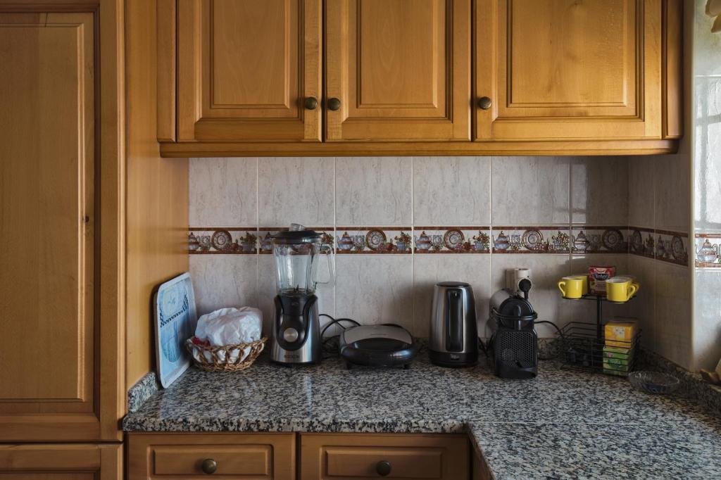 Kuchyň nebo kuchyňský kout v ubytování Quarto em Viana do Castelo