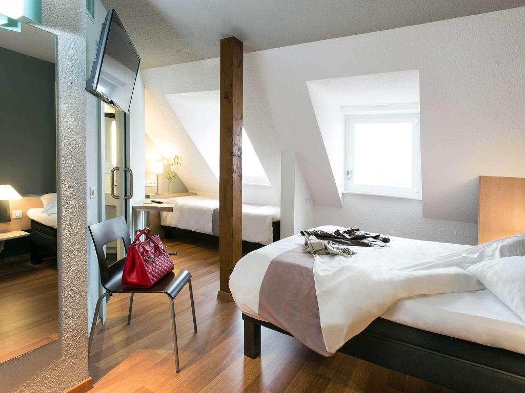 Postel nebo postele na pokoji v ubytování ibis Colmar Centre