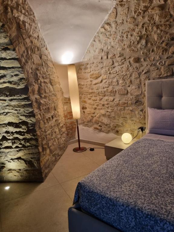 Postel nebo postele na pokoji v ubytování Suite D'AVALOS
