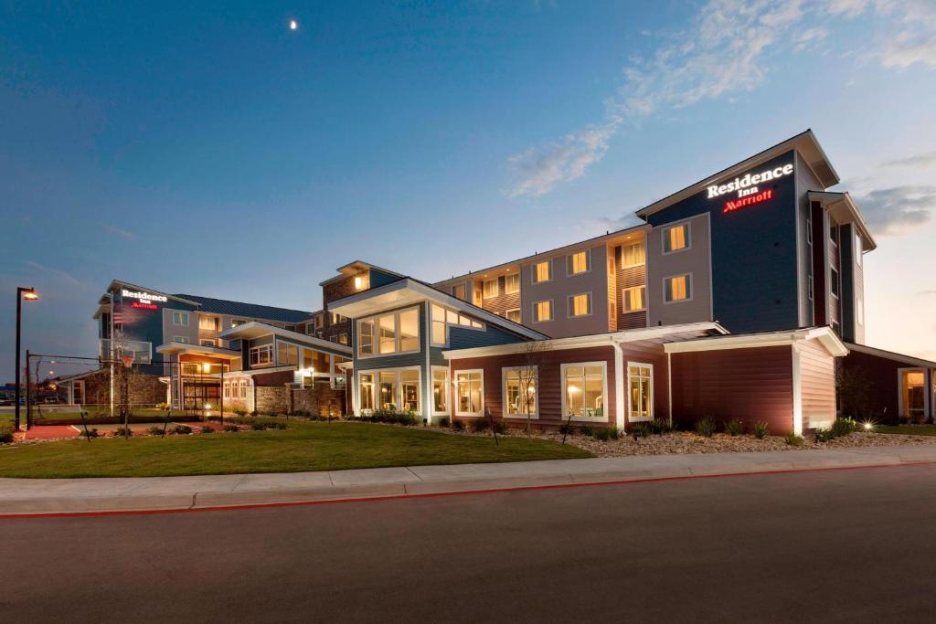 a large building on the side of a street at Residence Inn San Angelo in San Angelo