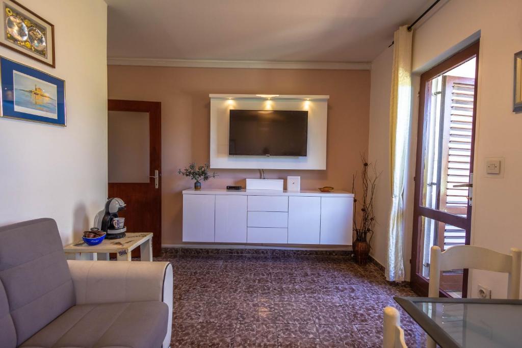 Televízia a/alebo spoločenská miestnosť v ubytovaní apartman Dag
