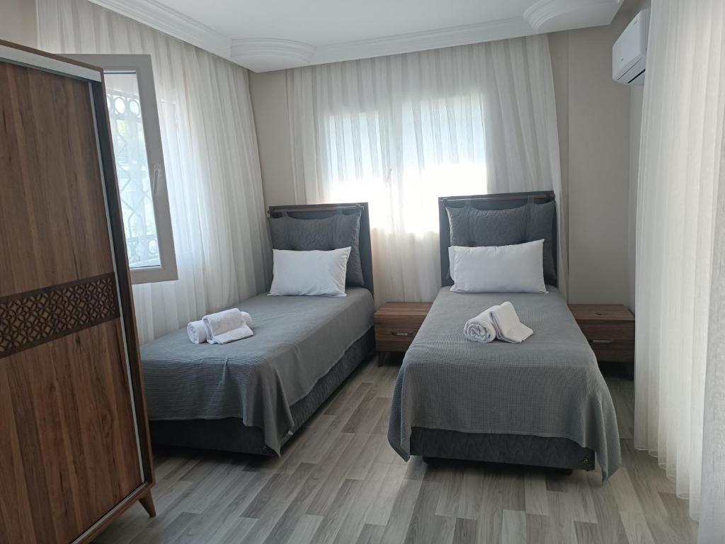 Postel nebo postele na pokoji v ubytování Begonville Villas Ladies Beach