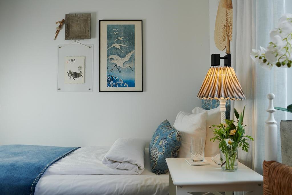 Postel nebo postele na pokoji v ubytování Hotell Bäckagården