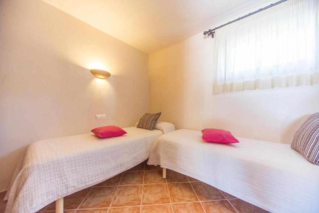 A bed or beds in a room at Finca Cas Contador Mallorca