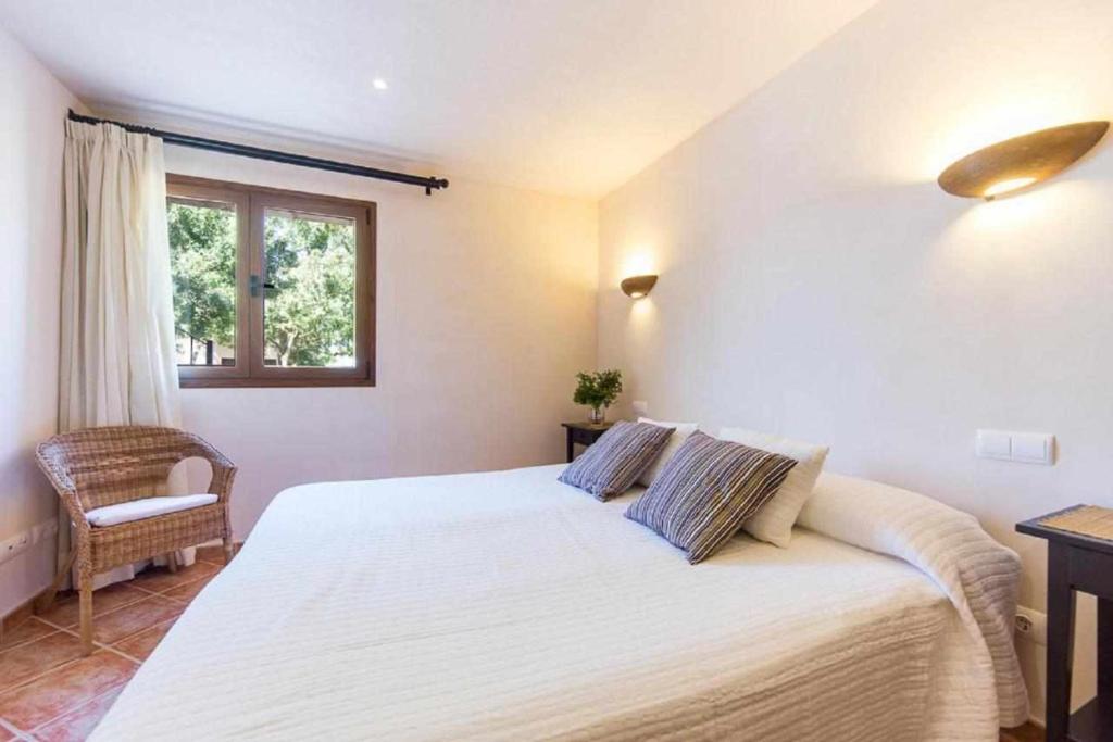 A bed or beds in a room at Finca Cas Contador Mallorca