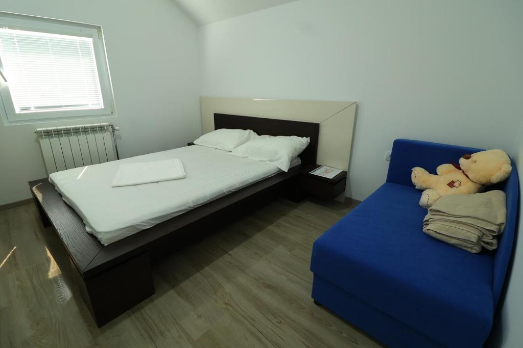 Ένα ή περισσότερα κρεβάτια σε δωμάτιο στο Tc Lux