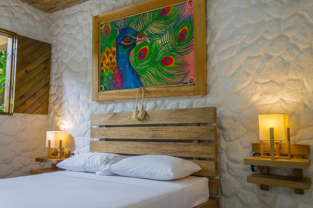 Postel nebo postele na pokoji v ubytování Hotel Cabañas Club Sierra Limón