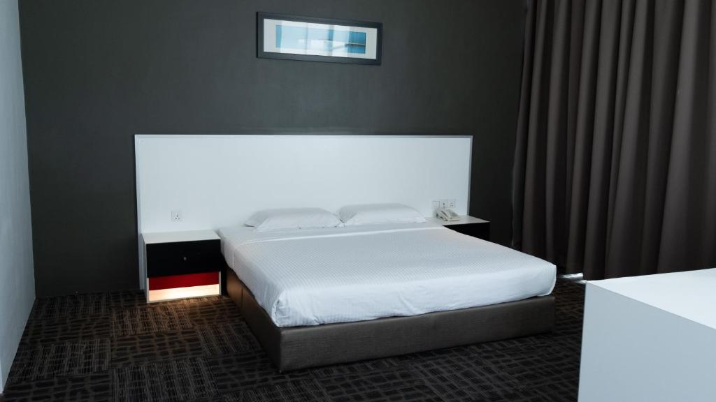 Postel nebo postele na pokoji v ubytování Beverly Hotel