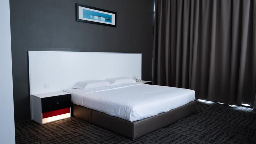 Postel nebo postele na pokoji v ubytování Beverly Hotel