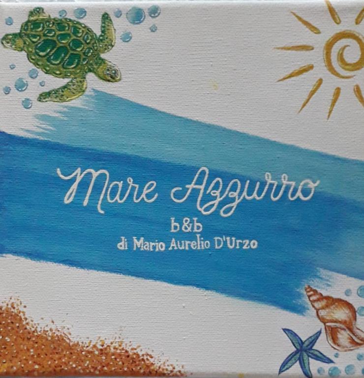 a birthday cake with a turtle on a beach at Mare Azzurro in Torre del Greco