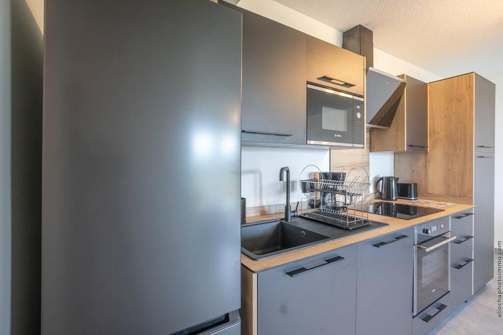 Kuchyň nebo kuchyňský kout v ubytování Navira - Appartement le Pavillon