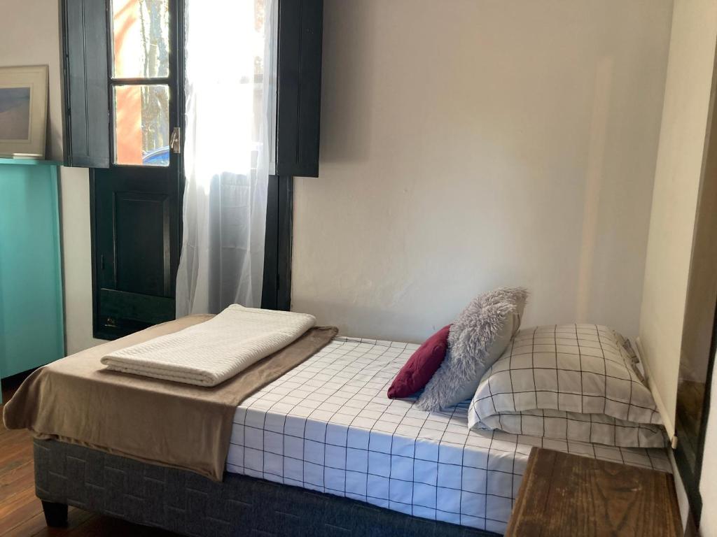 Postel nebo postele na pokoji v ubytování Rincón Colonial