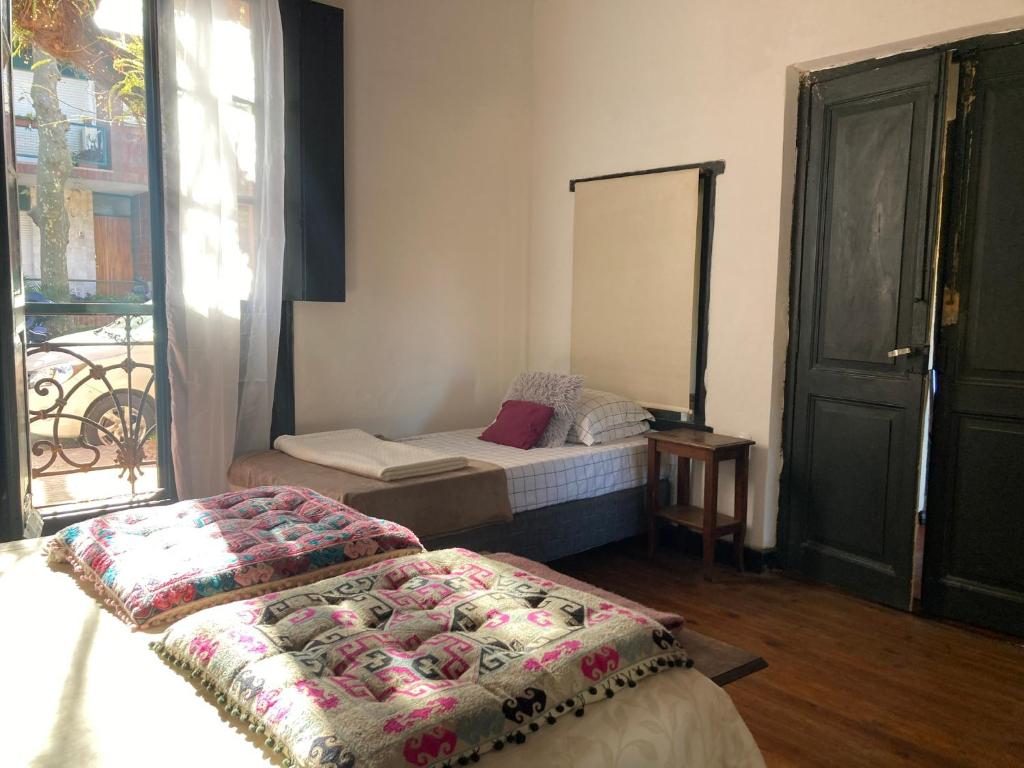 Postel nebo postele na pokoji v ubytování Rincón Colonial