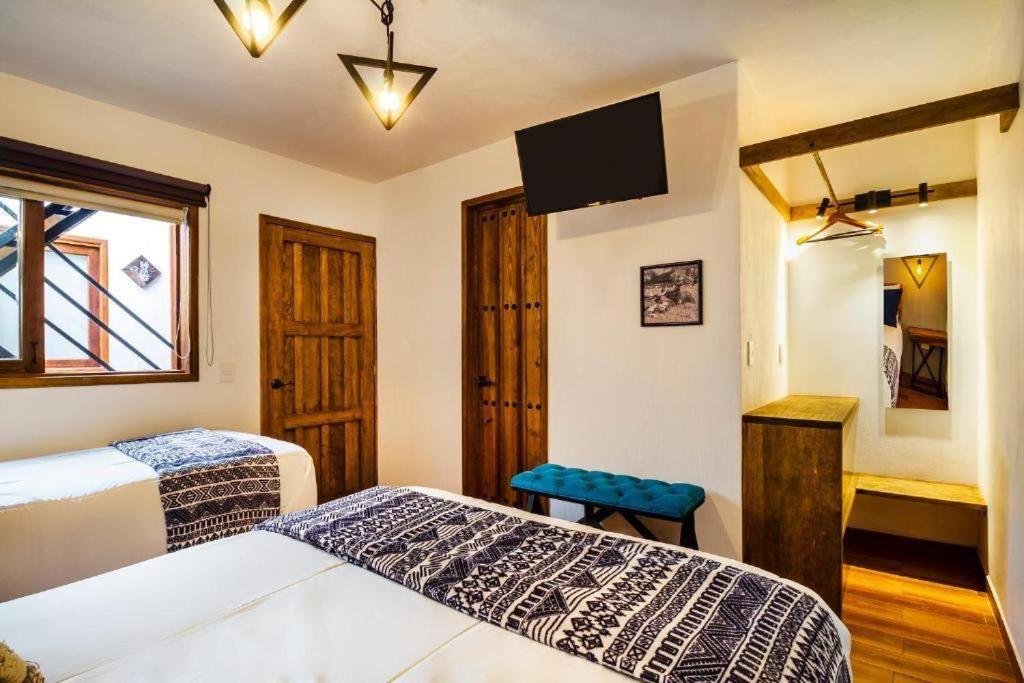 Postel nebo postele na pokoji v ubytování Hotel Kali