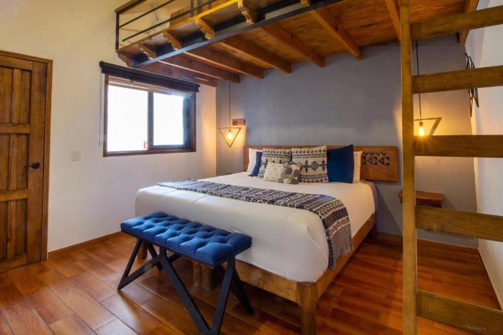 Postel nebo postele na pokoji v ubytování Hotel Kali