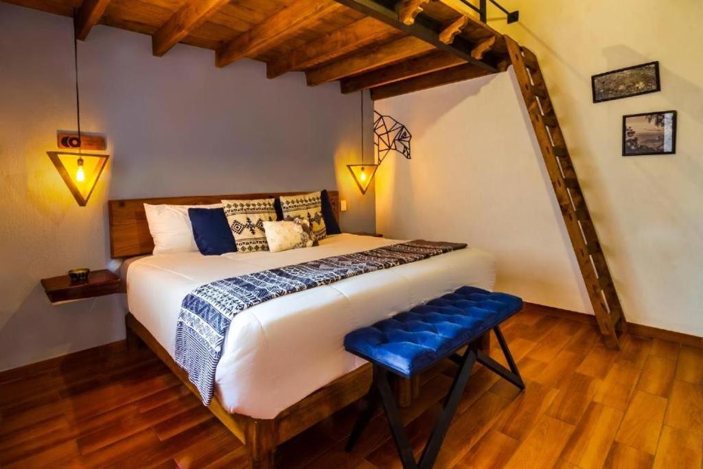 Postel nebo postele na pokoji v ubytování Hotel Kali