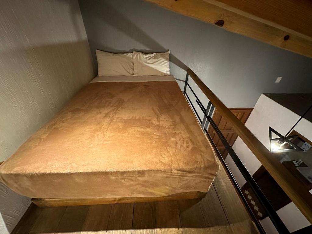 Postel nebo postele na pokoji v ubytování Hotel Kali